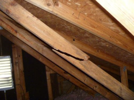 View From Inside Attic Of Broken Roof Truss 