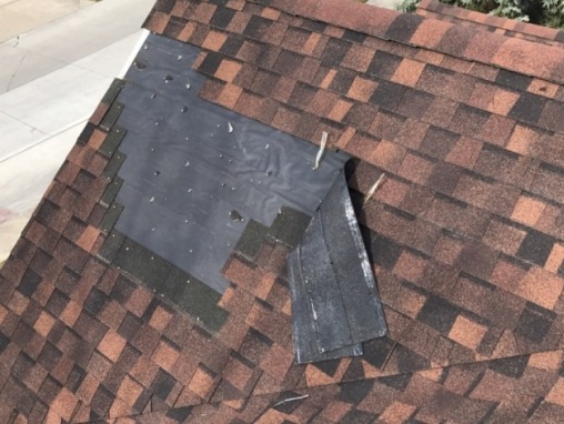 Wind Damaged Roof In Need of Repair